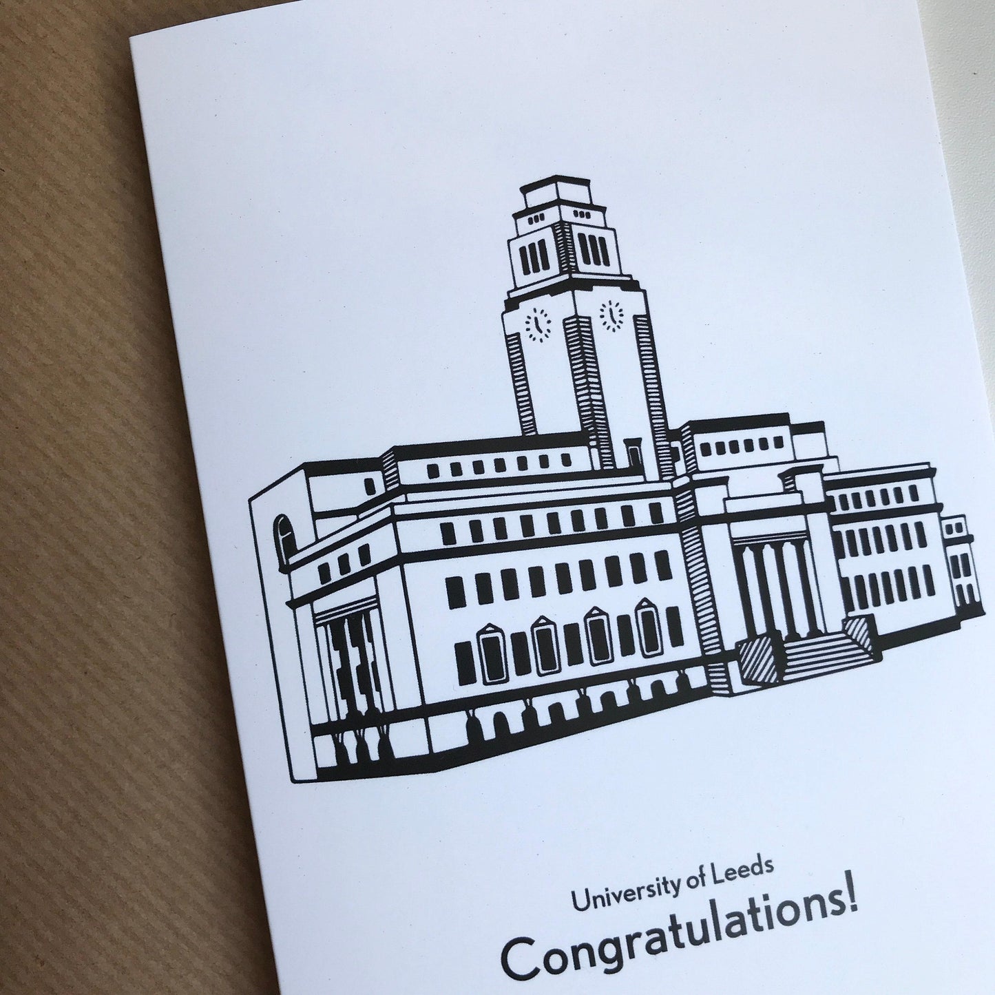 Greeting card with a black and white illustration of a building and 'University of Leeds Congratulations!' text.
