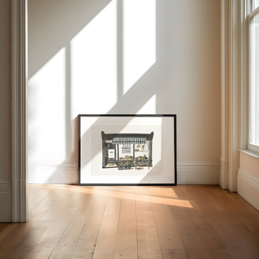 Framed artwork of 109 general store on a wall with sunlight casting shadows