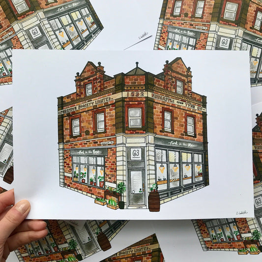 Hand holding a drawing of a brick building with a white background