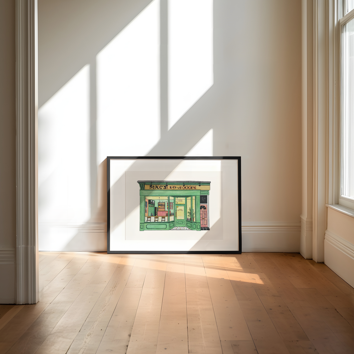 Framed artwork of House bar heaton on a wall in a room with sunlight streaming through windows