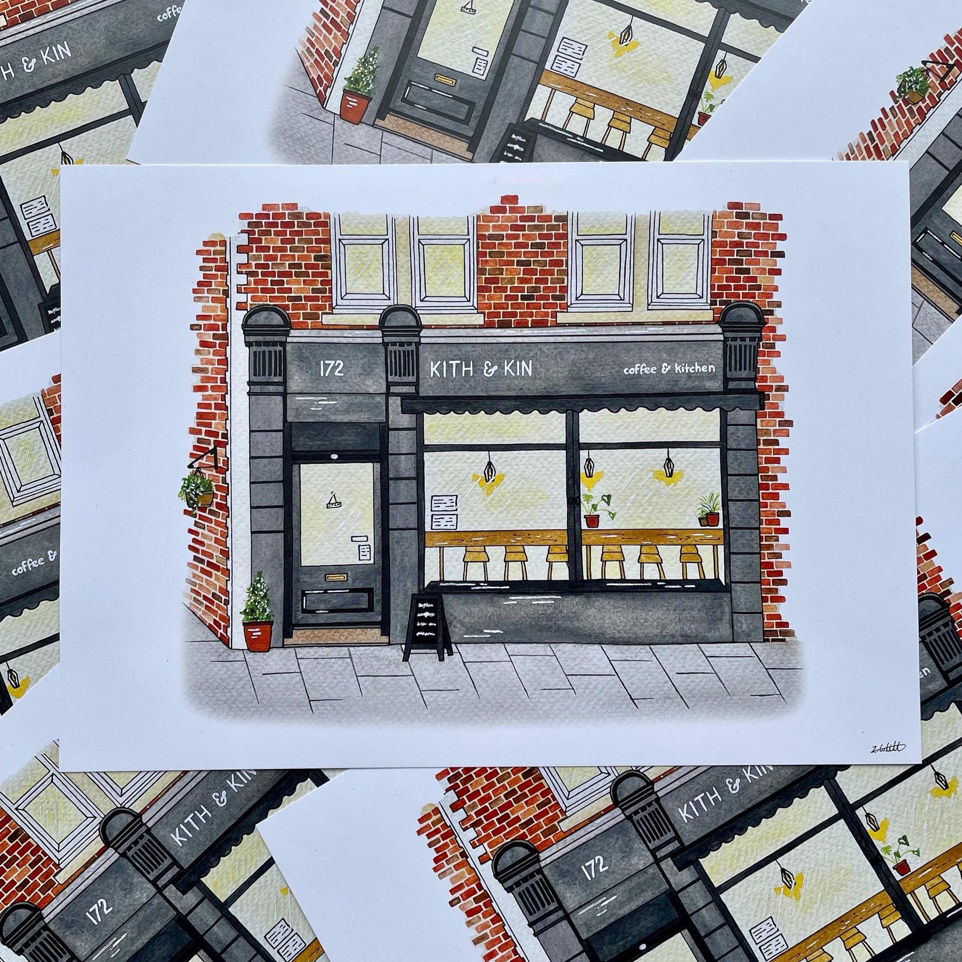 Illustration of a coffee shop named 'Kith & Kin' on a white card with a patterned background.