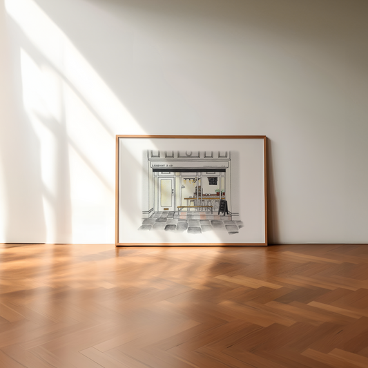 Framed artwork of Laneway Coffee newcastle Upon Tyne on a wall in a room with wooden flooring