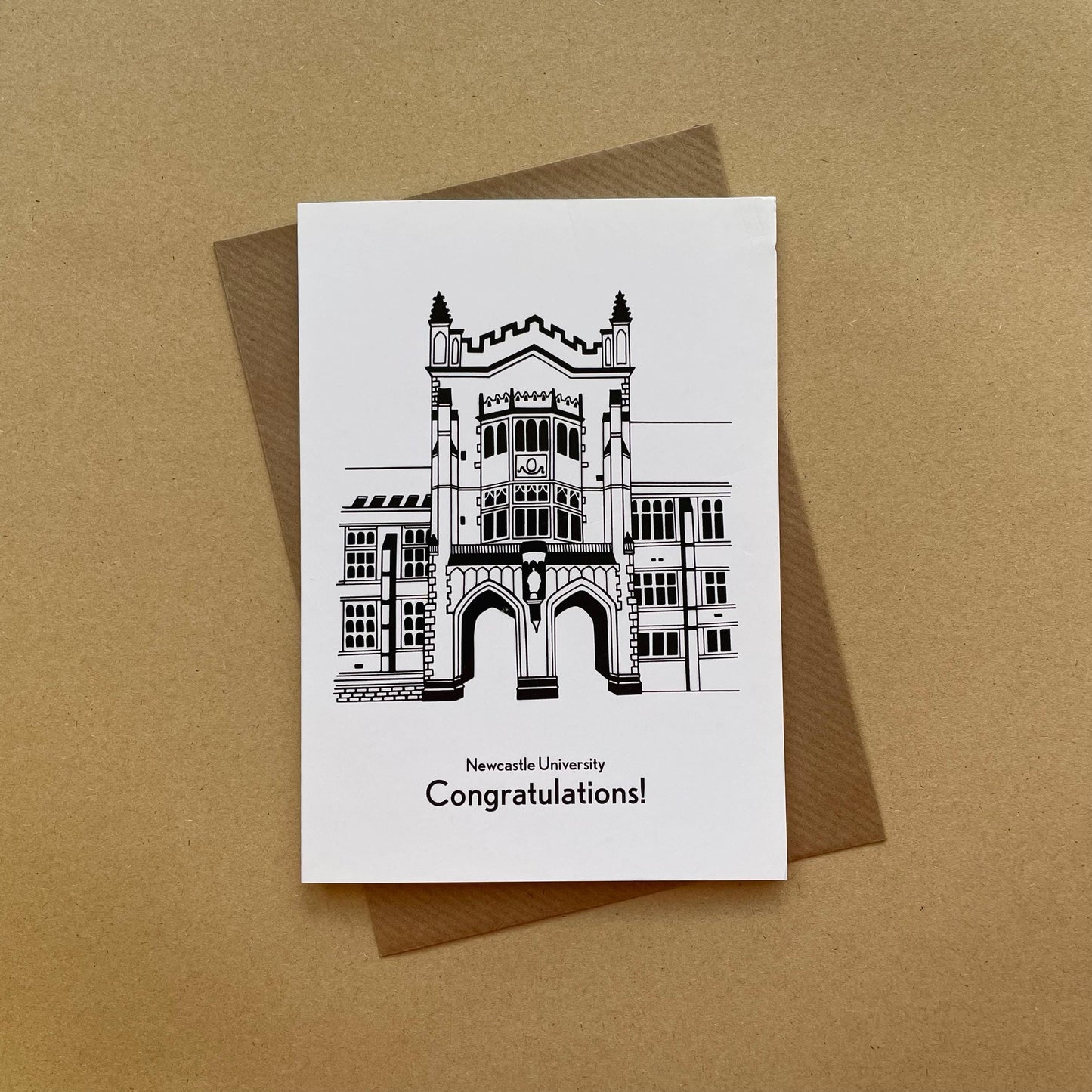 Greeting card with Newcastle University building illustration and 'Congratulations!' text on a brown background