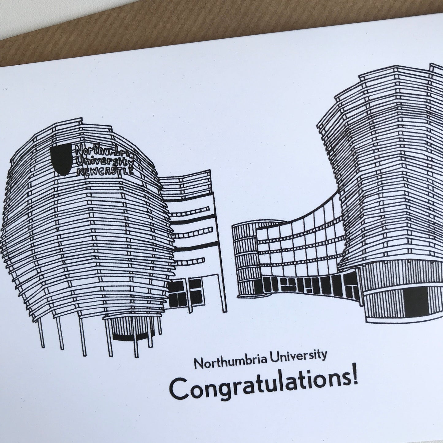 Greeting card with black line art of Northumbria University buildings and 'Congratulations!' text.