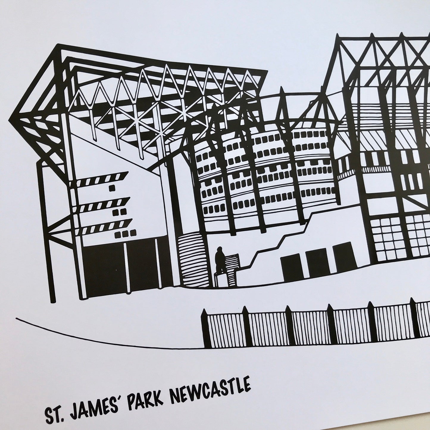 Black and white illustration of St. James' Park Newcastle on a light blue background