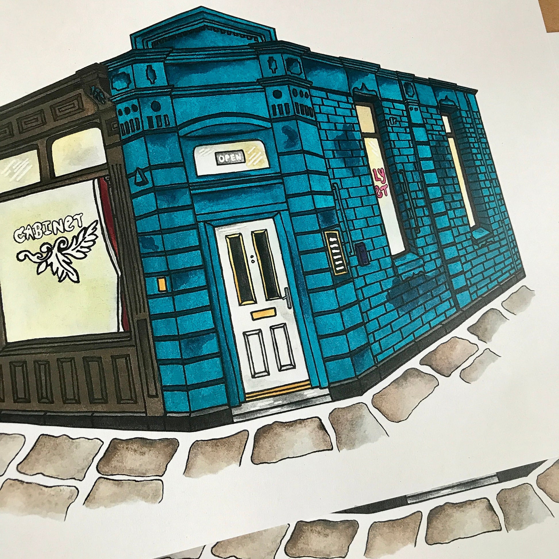 Colorful illustration of a blue building with a white door on a white background