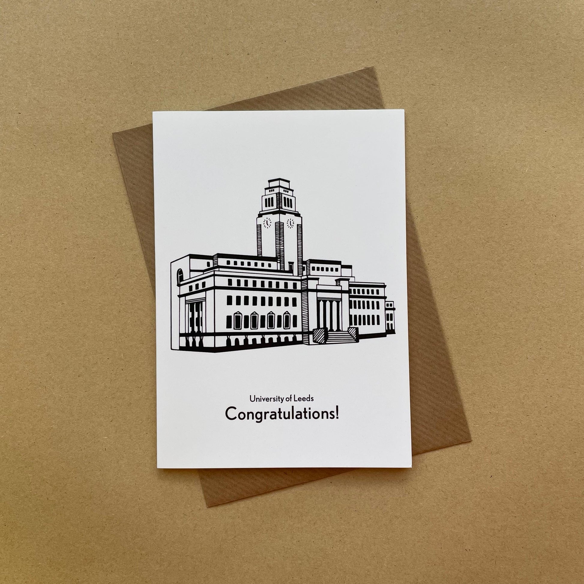 Greeting card with a building illustration and 'University of Leeds Congratulations!' text on a brown background