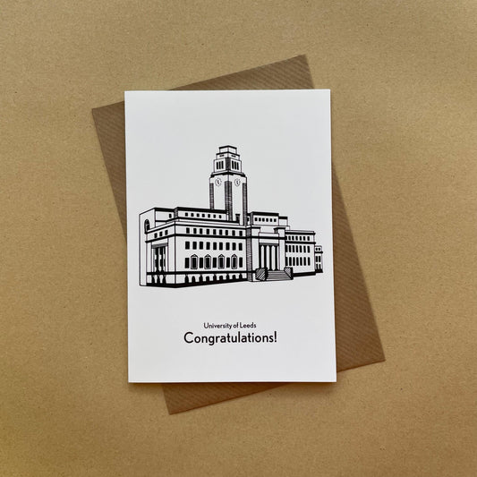 Greeting card with a building illustration and 'University of Leeds Congratulations!' text on a brown background