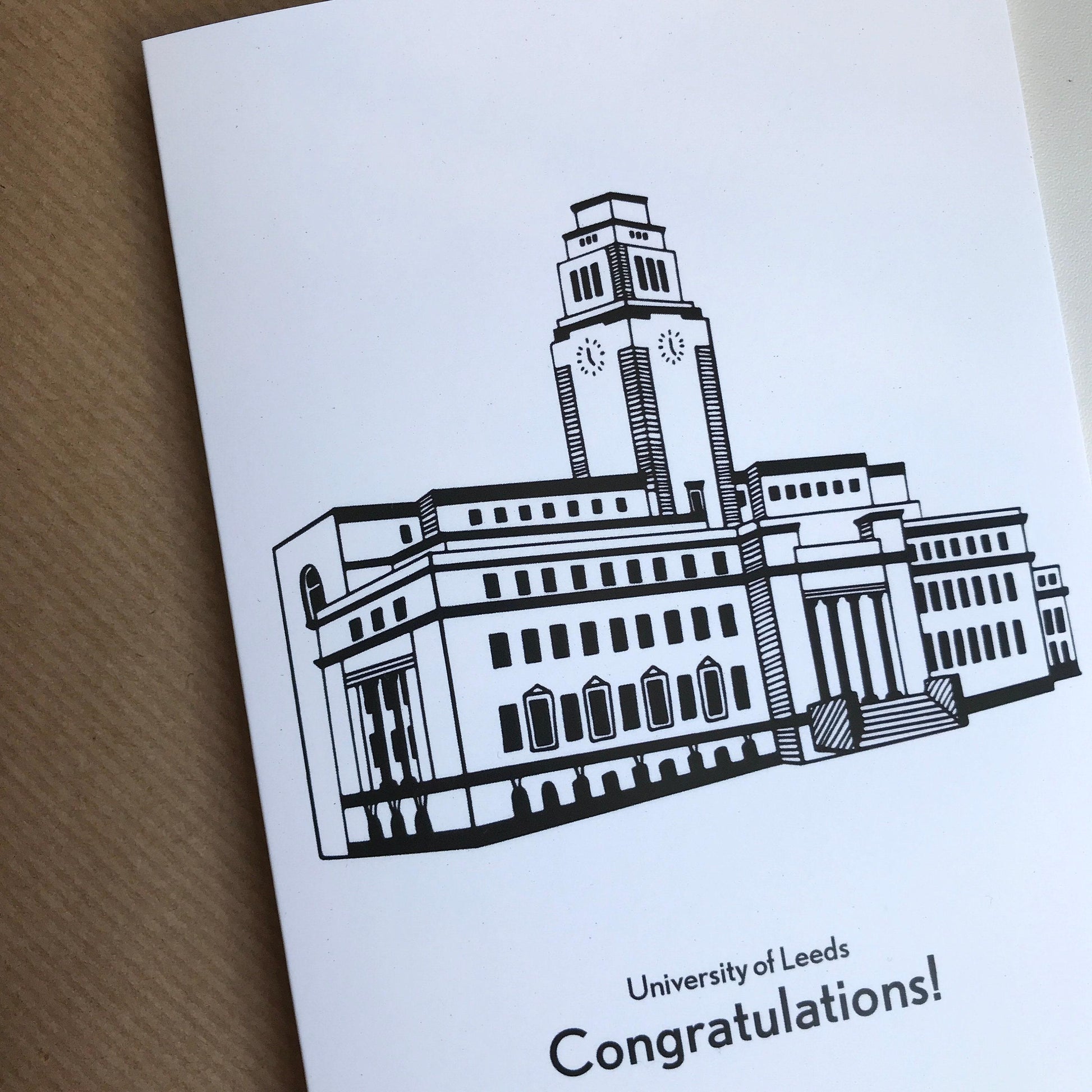 Greeting card with a black and white illustration of a building and 'University of Leeds Congratulations!' text.