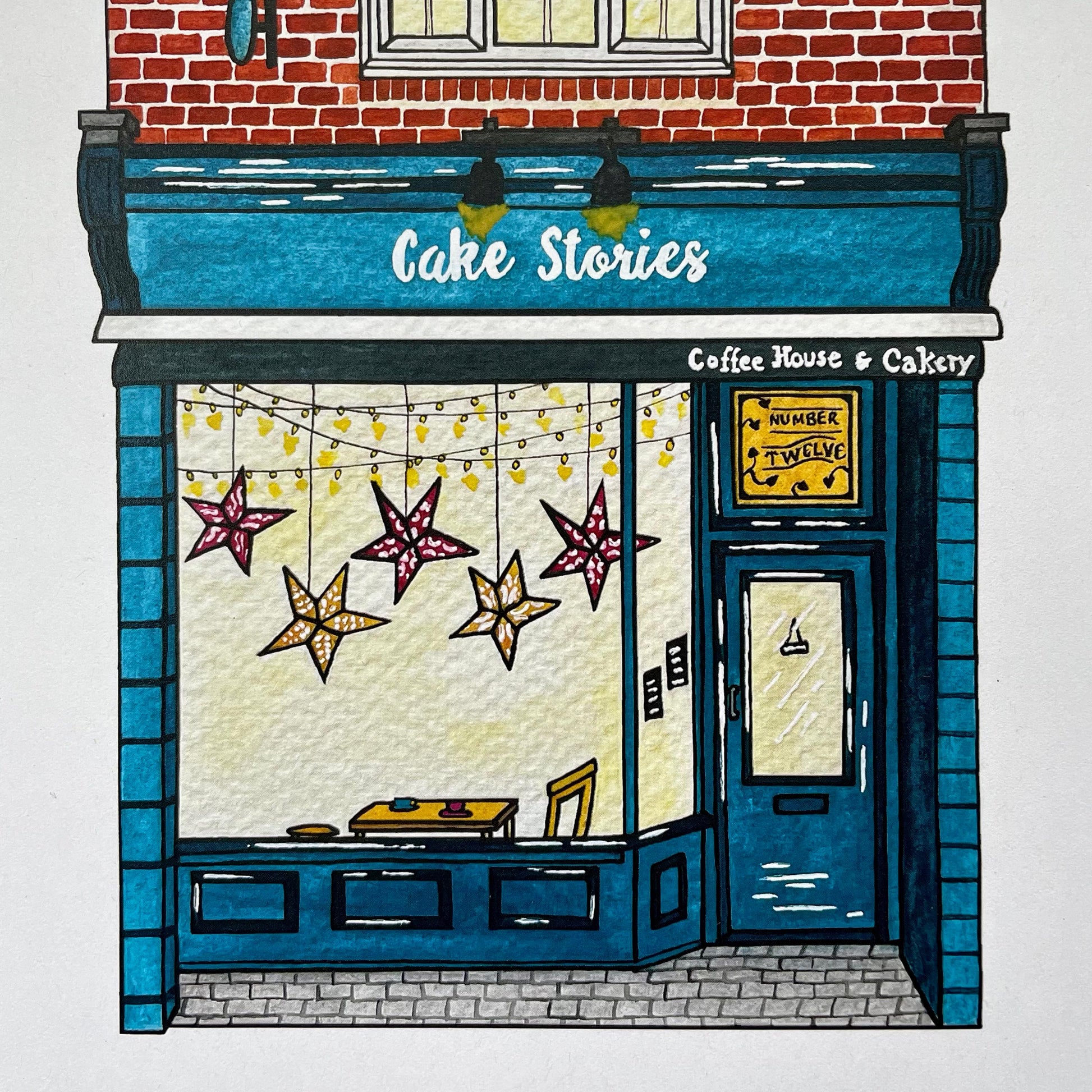 Illustration of a coffee house and bakery named 'Cake Stories' with decorative stars in the window.