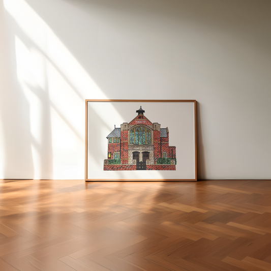 Framed artwork of a east riding theatre beverley on a white wall with wooden floor