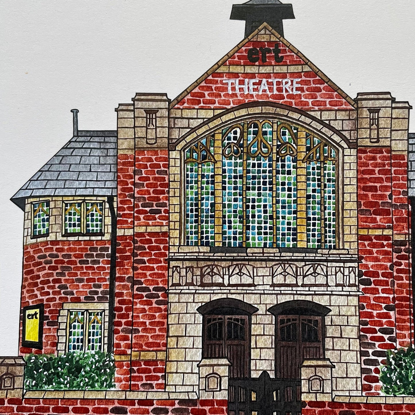 Illustration of a brick building with a stained glass window labeled 'Theatre'.