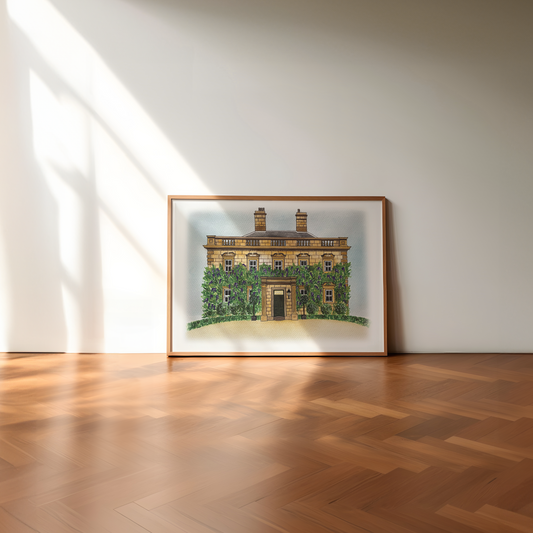 Framed artwork of eshott hall northumberland building on a white wall with wooden floor