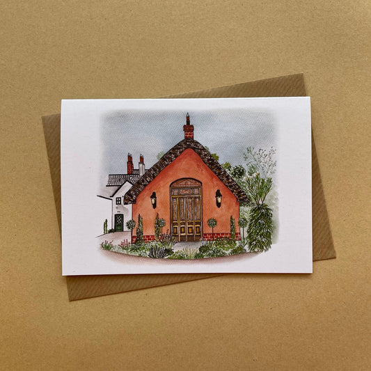 Greeting card with a le Petit Château wedding venue illustration on a brown background