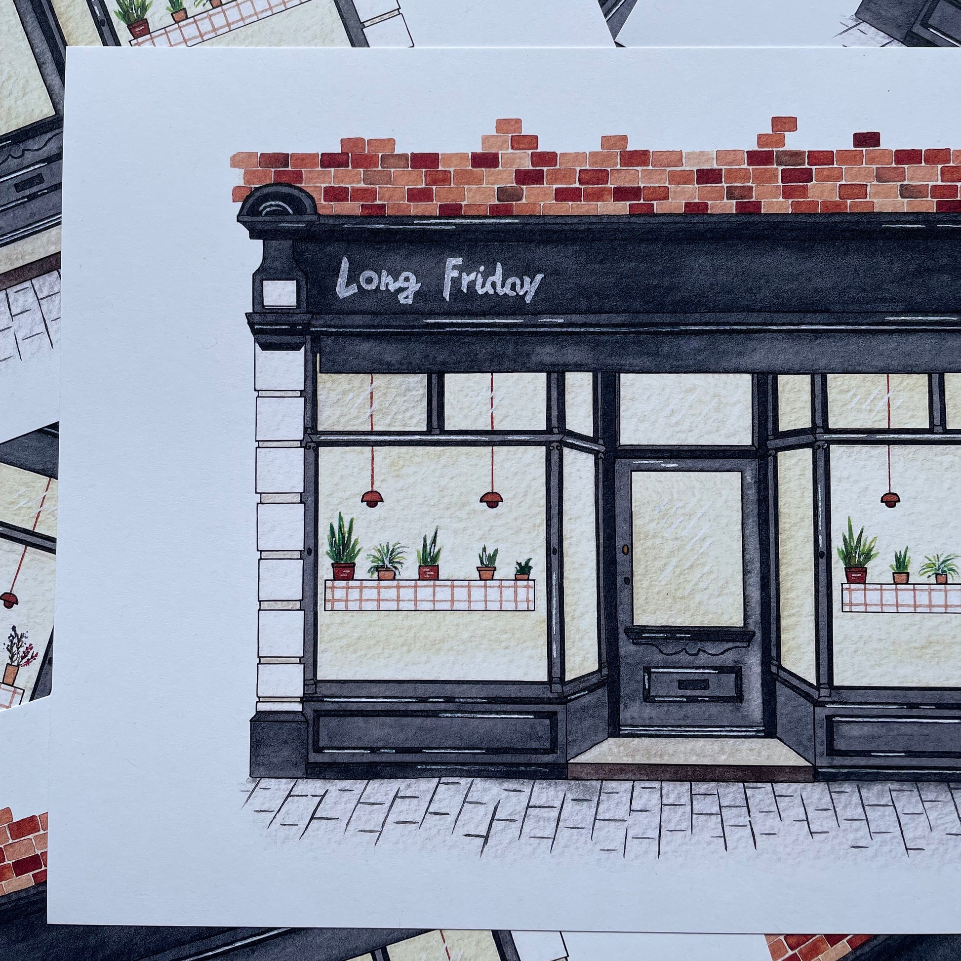 Decorative shop front with 'Long Friday' text on a white background